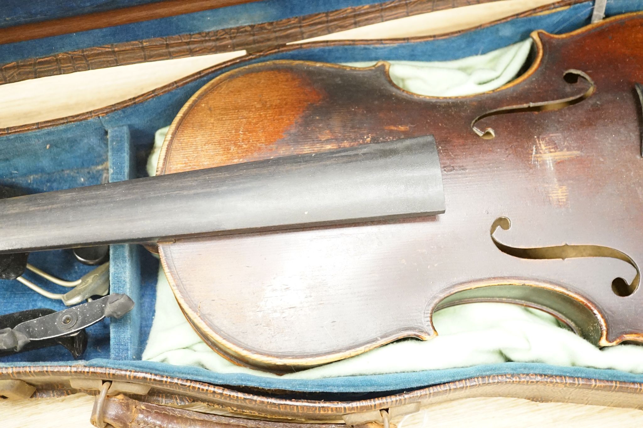 A late 19th century German violin and two bows, cased